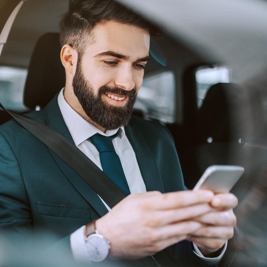 Arbor customer using their phone in a car.